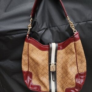 L.A.M.B. Rare Commodore lipstick saddle bag